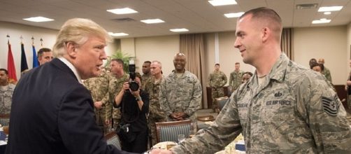 Trump greets airman (Defense Department wikimedia commons)