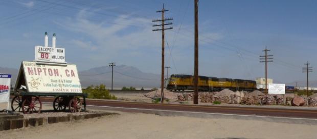 View of Nipton, California, with freight train passing through | Stan Shebs via Wikimedia Commons View of Nipton, California, with freight train passing through | Stan Shebs via Wikimedia Commons