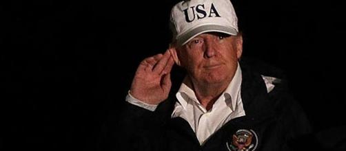 Trump faces criticism for wearing campaign hat during Hurricane Harvey visit to Texas. Image credit - The Young Turks/YouTube,