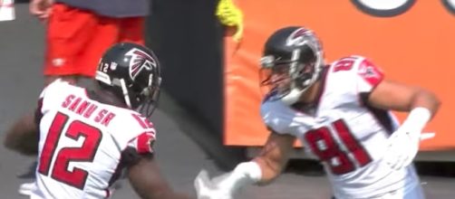 The Atlanta Falcons celebrate after Austin Hooper's 88-yard touchdown reception. [Image via NFL/YouTube]