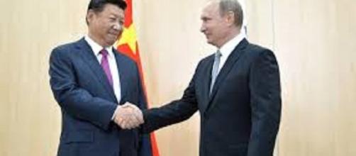Russia and China backed sanctions. https://upload.wikimedia.org/wikipedia/commons/7/73/Vladimir_Putin_and_Xi_Jinping%2C_BRICS_summit_2015_01.jpg