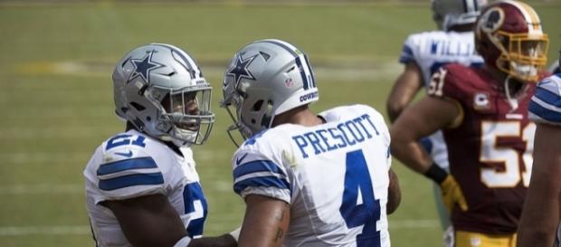Dallas Cowboys' Dak Prescott and Ezekiel Elliott alongside each other. Image Credit: Keith Allison, Flickr -- CC BY-SA 2.0 Dallas Cowboys' Dak Prescott and Ezekiel Elliott alongside each other. Image Credit: Keith Allison, Flickr -- CC BY-SA 2.0
