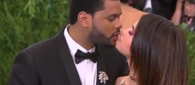 Selena Gomez and The Weekend reportedly moved in together in New York City. YouTube/E!News Selena Gomez and The Weekend reportedly moved in together in New York City. YouTube/E!News