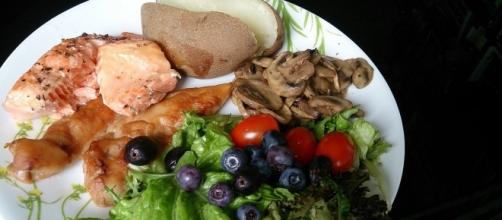 Eat healthy meals, like this plateful of mushrooms, salad, potatoe, tomato, salmon and berries (ProjectManhattan/Wikimedia Commons).