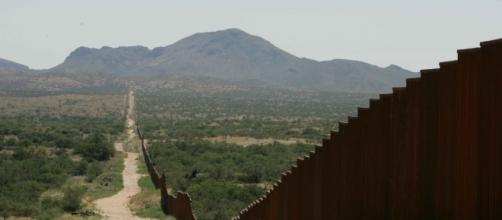 A long border wall similar to the proposed Mexican-American border wall. Source; commons.wikimedia.com