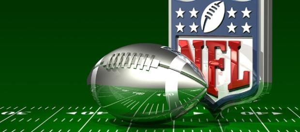 C_osett Follow Silver Football and NFL Logo On Top of a Green Field - CCO Public Domain | Flickr C_osett Follow Silver Football and NFL Logo On Top of a Green Field - CCO Public Domain | Flickr