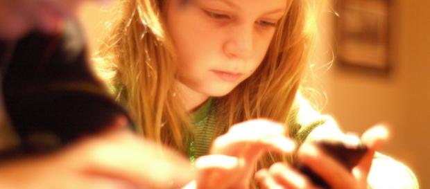 Elementary-aged children more likely to experience cyberbullying if they their own phone. - Image Credit: Tinkerbrad/ Flickr Elementary-aged children more likely to experience cyberbullying if they their own phone. - Image Credit: Tinkerbrad/ Flickr