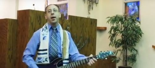 Eric Komar is shown during a 2015 performance at Temple Beth Am in Parsippany, New Jersey. https://www.youtube.com/watch?v=xLuz00E4akE