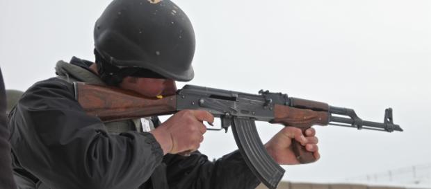An Afghan uniformed police officer fires his AK-47 rifle.Source;commons.wikimedia.org An Afghan uniformed police officer fires his AK-47 rifle.Source;commons.wikimedia.org