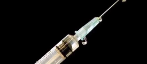 Syringe used for injecting drugs. (Image from Democracy Now!/Youtube)
