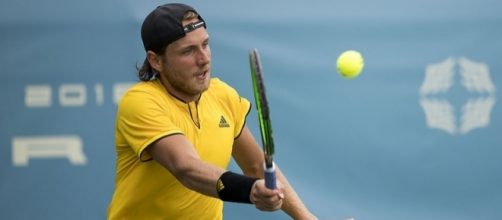 French tennis player Lucas Pouille plays a volley. Image Credit. Keith Allison, Flickr -- CC BY-SA 2.0