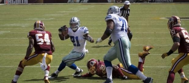 Dallas Cowboys running back Ezekiel Elliott rushing against the Washington Redskins. Image Credit: Keith Allisson, Flickr -- CC BY-SA 2.0 Dallas Cowboys running back Ezekiel Elliott rushing against the Washington Redskins. Image Credit: Keith Allisson, Flickr -- CC BY-SA 2.0