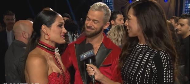 Nikki Bella with partner Artem Chigvintsev after their performance in "Dancing With the Stars." Photo - extratv/YouTube Nikki Bella with partner Artem Chigvintsev after their performance in "Dancing With the Stars." Photo - extratv/YouTube