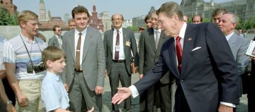 President Reagan greets a young boy while touring Red Square by Fed Govt/Wikimedia Commons