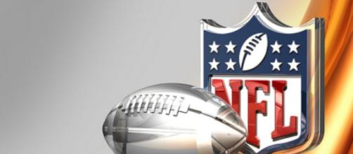 Silver Football and NFL Logo Over Bronze Silk Background- Image by C_osett \ CCo Public Domain | Flickr