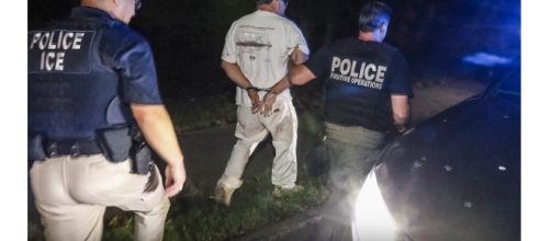 Immigration customs enforcement arrest photo via Atlanta Journal-Constitution/YouTube