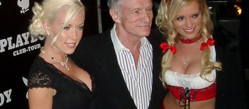'Playboy' founder, Hugh Hefner (middle), with the girls [Credit: Alexander Hauk via Wikimedia Commons]