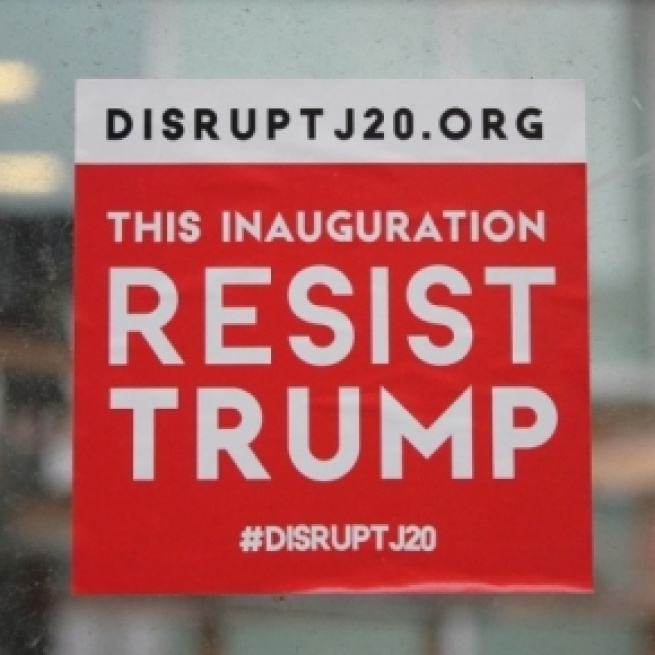 DisruptJ20 sticker at Donald Trump's inauguration ceremony. [Image Credit: Elvert Barnes/Flickr]