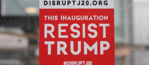 DisruptJ20 sticker at Donald Trump's inauguration ceremony. [Image Credit: Elvert Barnes/Flickr]