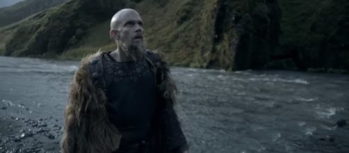 Floki marvels at a waterfalls in Iceland and sees something surprising. [Image Credit: YouTube/History]
