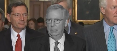 A greyed out Mitch McConnell. [Image Credit: PBS Newshour/YouTube)