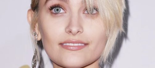 Paris Jackson poses nude as she flaunted her newest chakra tattoo symbol on her chest. YouTube/Hollyscoop