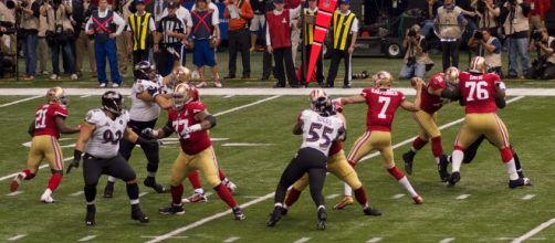 San Francisco 49ers quarterback Colin Kaepernick attempts a pass in Super Bowl XLVII. Photo by Au Kirk, courtesy of Flickr.com