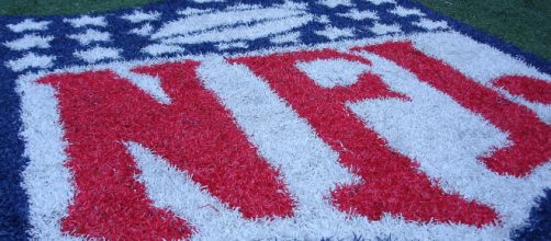 The NFL logo on the field. - [Photo credit to Jonathan Moreau via Flickr]