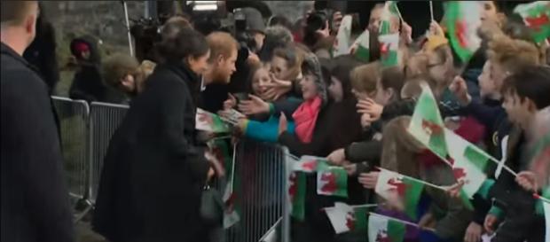 Prince Harry and Meghan Markle Meet Royal Fans in Cardiff Wales (2018) -Image credit - WalrusRider | YouTube Prince Harry and Meghan Markle Meet Royal Fans in Cardiff Wales (2018) -Image credit - WalrusRider | YouTube