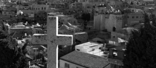 A symbol of Christianity looks out over the disputed city of Jerusalem - Kenneth Reitz - Flickr
