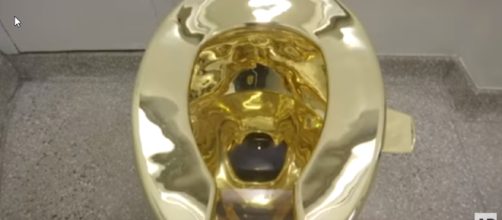 The 14k gold toilet offered to Trump and Melania in place of the Van Gogh they requested. [image source: Associated Press/YouTube screenshot]