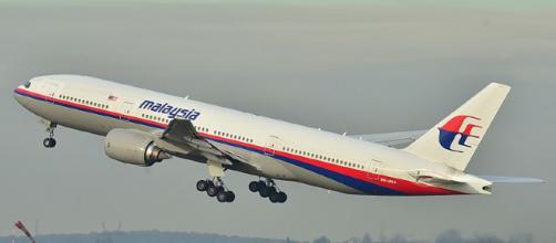 A Malaysian Airlines Boeing 777 takes off during a past flight.- [image via wikimedia commons/Laurent Errera]