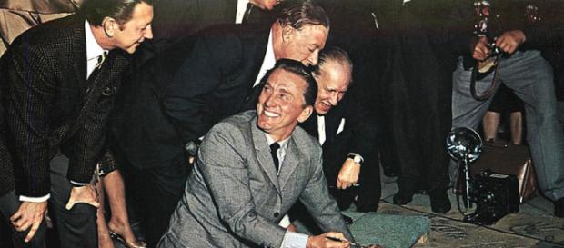 Kirk Douglas signs his name in the wet concrete at Grauman's Chinese Theatre (Image credit – Mitoc and Sons, Wikimedia Commons) Kirk Douglas signs his name in the wet concrete at Grauman's Chinese Theatre (Image credit – Mitoc and Sons, Wikimedia Commons)