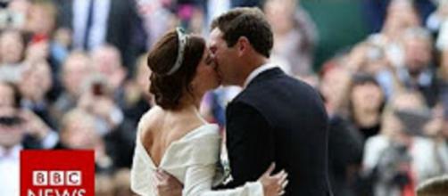 Princess Eugenie was proud to display the scars on her back on her royal wedding day. [Image source: BBC News-YouTube]