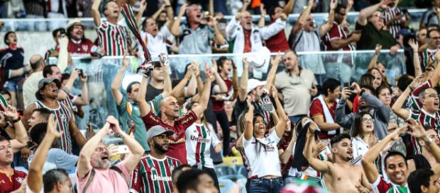 Torcedores organizam grande festa no Maracanã contra o Deportivo Cuenca (Foto: O Globo) Torcedores organizam grande festa no Maracanã contra o Deportivo Cuenca (Foto: O Globo)