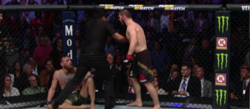 After scoring the submission win, Khabib Nurmagomedov yells at Conor McGregor, leading to a major brawl. [Image via UFC on FOX/YouTube Screencap]
