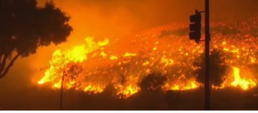 California Sees Most Destructive Wildfire in History. [Image source/RT America YouTube video]