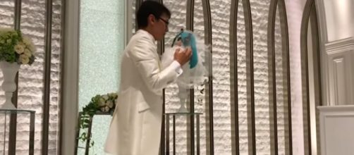 Akihiko Kondo, 35, married hologram represented by plushie toy of Hatsune Miku. [Image Source: World News - YouTube]