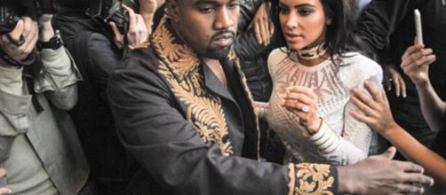 Kanye West and Kim Kardashian-West had private fire fighters save mansion. [Image Source:Rap Critic - YouTube]