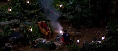Nick cooks bean burgers while his campmate share a feast in Snake Rock (Image credit: I'm A Celebrity...Get Me Out Of Here! ITV/ YouTube.com)