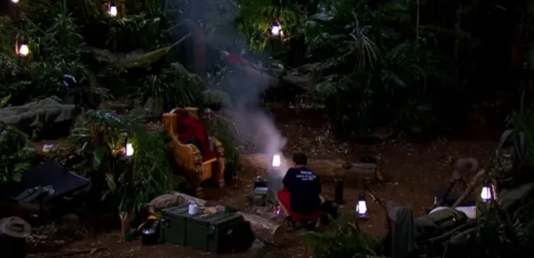 Nick cooks bean burgers while his campmate share a feast in Snake Rock (Image credit: I'm A Celebrity...Get Me Out Of Here! ITV/ YouTube.com)