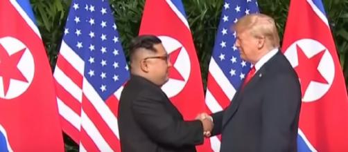 Moment Kim Jong-un and Donald Trump share historic handshake [Image courtesy – Guardian News YouTube video]