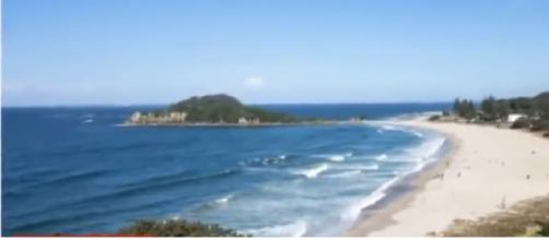 View of Matata beach from where NZ fisherman rescued a baby from the ocean. [Image source/News 4 U YouTube video]
