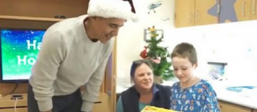 Barack Obama delivers presents to kids at Children’s National hospital in DC. [Image source/Channel 14 YouTube video]