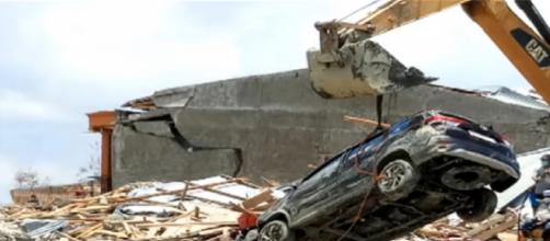 168 dead and many missing in Indonesia tsunami. [Image source/SABC Digital News YouTube video]