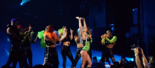 A blue-haired Lady Gaga packs Enigma with emotion, power, and gratitude in Las Vegas. [Image source:Henry Morales-YouTube]
