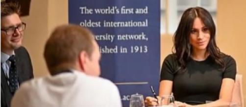Meghan Markle makes surprise appearance at King's College London. [Image source/USA NEWS YouTube video]