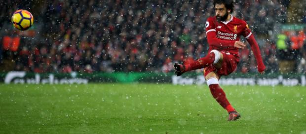 Mohamed Salah en acción para Liverpool contra Everton en medio de la nieve en Anfield en diciembre. Mohamed Salah en acción para Liverpool contra Everton en medio de la nieve en Anfield en diciembre.