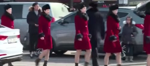 The North Korean cheer squad arriving for the games in matching wardrobe [Image via All in One TV NP / YouTube Screencap]