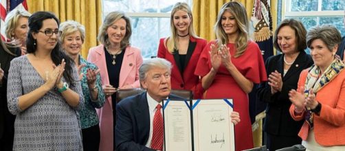 President Donald Trump in the Oval Office with Ivanka Trump and others (Image credit - Shealah Craighead, Wikimedia Commons)